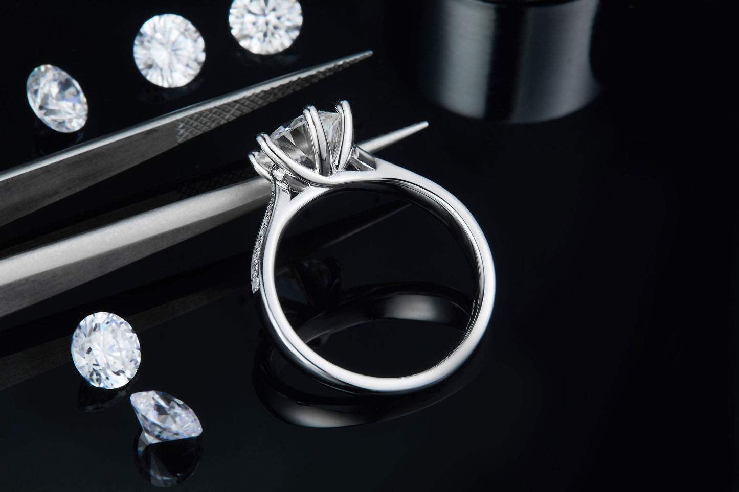 This ring showcases a 2.00ct moissanite with a dazzling pave setting, creating a luxurious and timeless look in sterling silver.