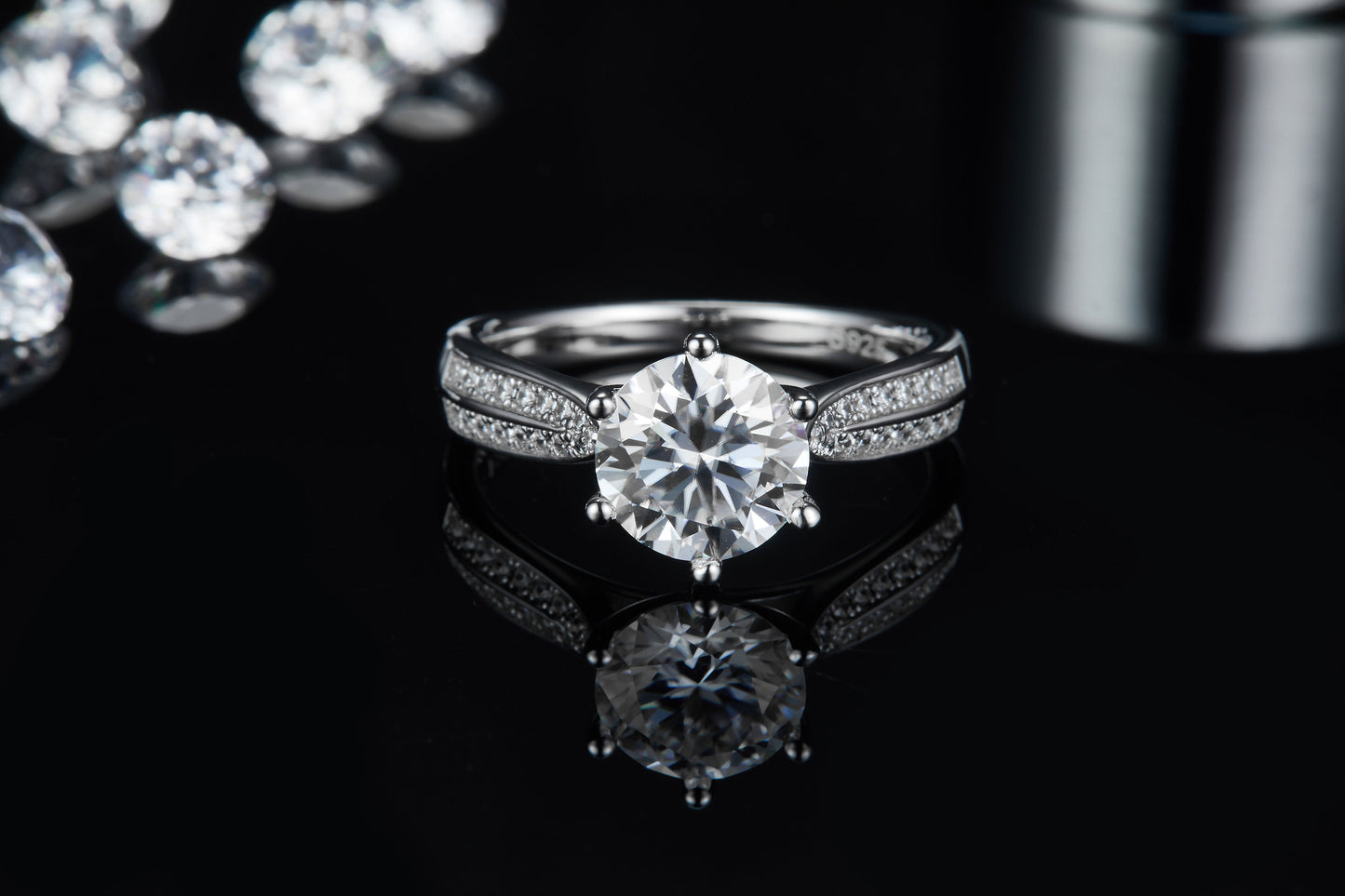 A beautiful engagement ring featuring a 2.00ct moissanite center stone and a pave-set band, all crafted in shimmering sterling silver.