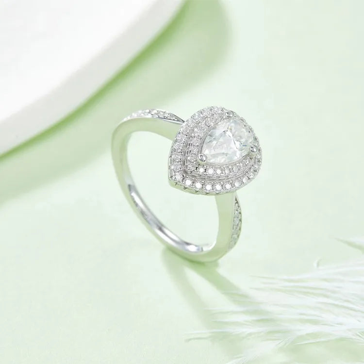 A bright and clear image showcasing the radiant sparkle of the moissanite and the double halo setting.