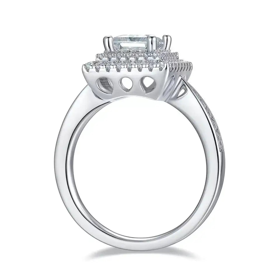 A luxurious engagement ring featuring a princess cut moissanite and a double halo for maximum sparkle.