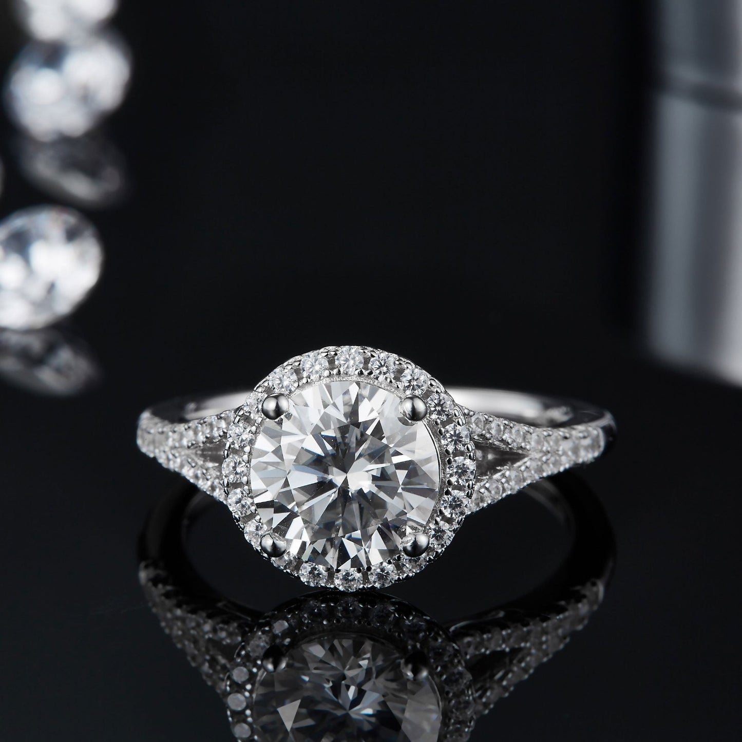 A radiant engagement ring featuring a large moissanite center stone and a brilliant halo.