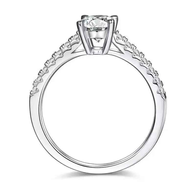 Angled view of a 1.00ct oval cut moissanite ring, emphasizing the classic basket setting and the ring's overall design.