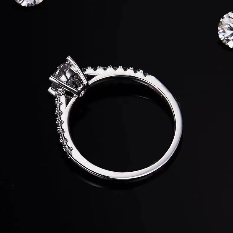 Detailed shot of the basket setting on a 1.00ct oval cut moissanite engagement ring, demonstrating its craftsmanship and secure hold.