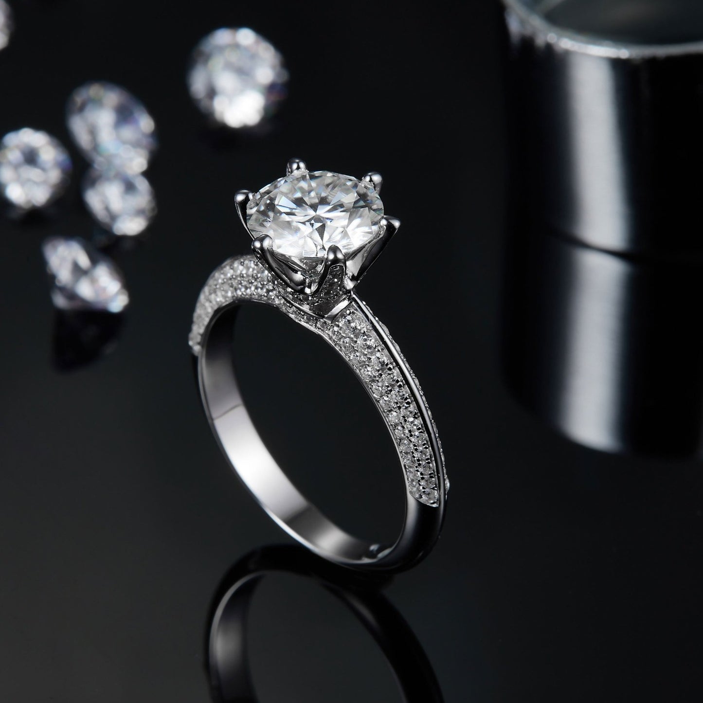 A radiant engagement ring with a 2.00ct moissanite center stone and a pave band that catches the light from every angle.