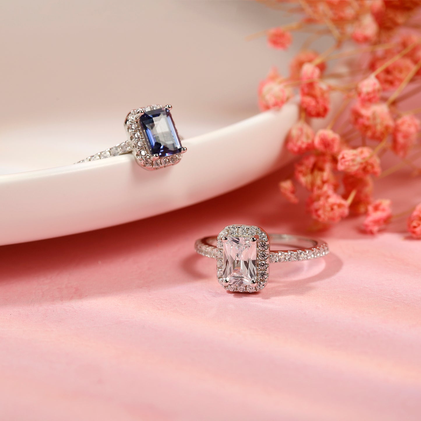 This engagement ring offers a touch of timeless sophistication with its emerald cut 1.00ct moissanite and surrounding halo, beautifully presented in sterling silver.