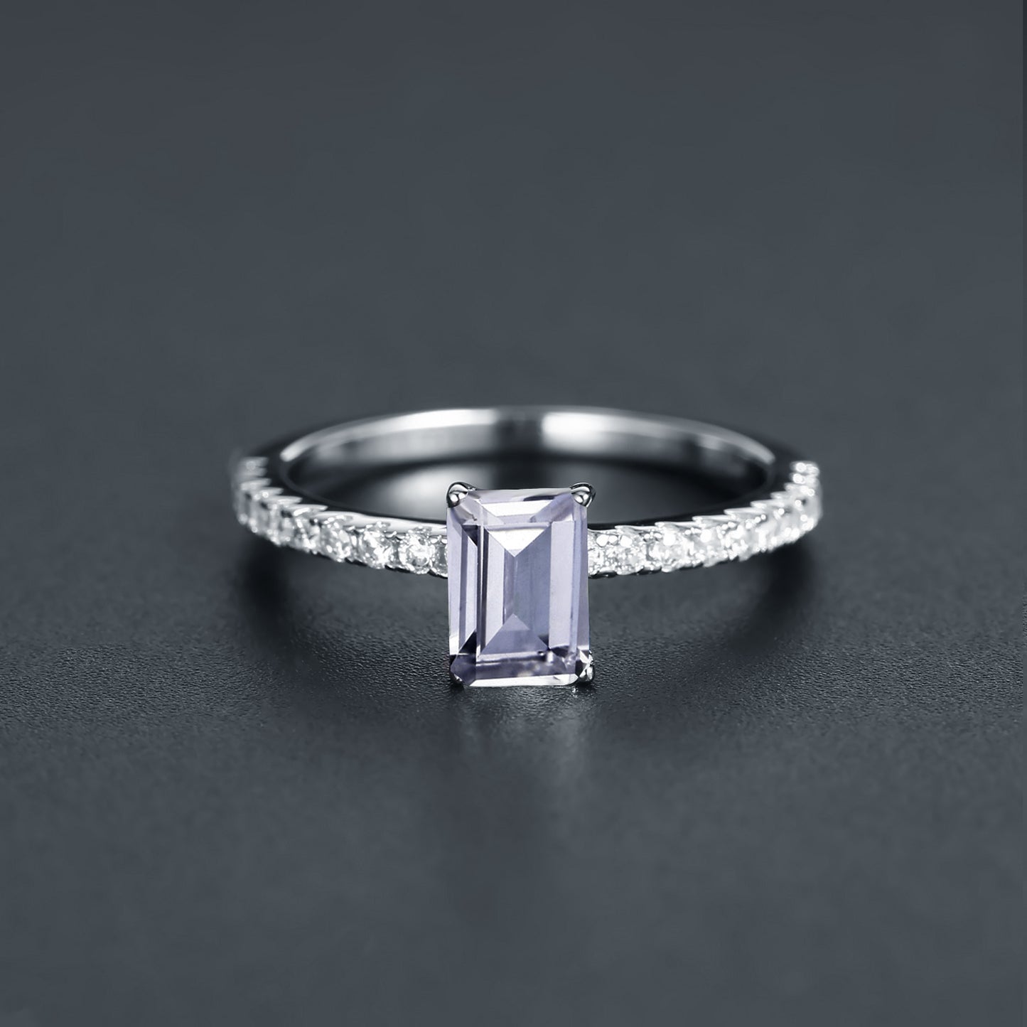 Showcasing the elegance of a 1.00ct emerald cut moissanite in a classic sterling silver setting.