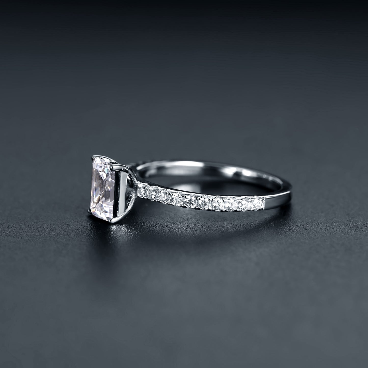A beautiful and timeless solitaire engagement ring featuring a 1.00ct emerald cut moissanite.