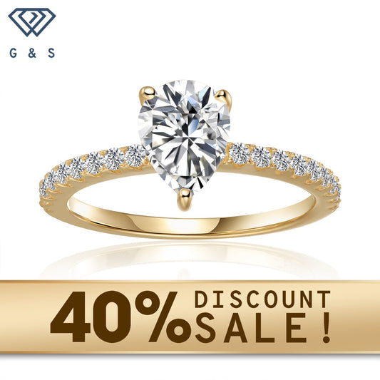 A dazzling 1.25ct pear-shaped moissanite takes center stage in this elegant 9ct yellow gold engagement ring, showcasing a classic and romantic design.
