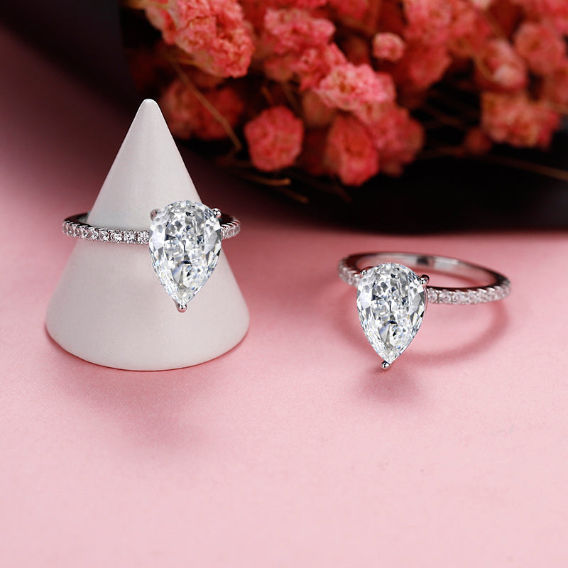 This sterling silver engagement ring highlights the unique beauty of a 1.25ct pear-shaped moissanite.