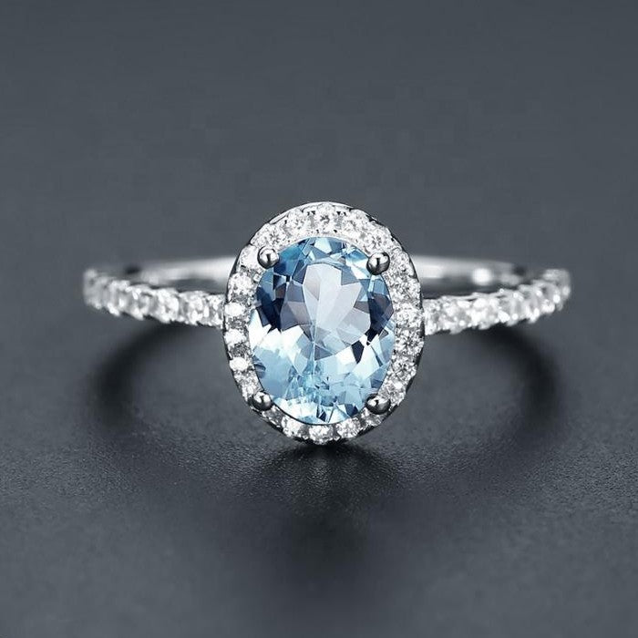 Classic Blue Topaz Halo Ring - Oval Cut