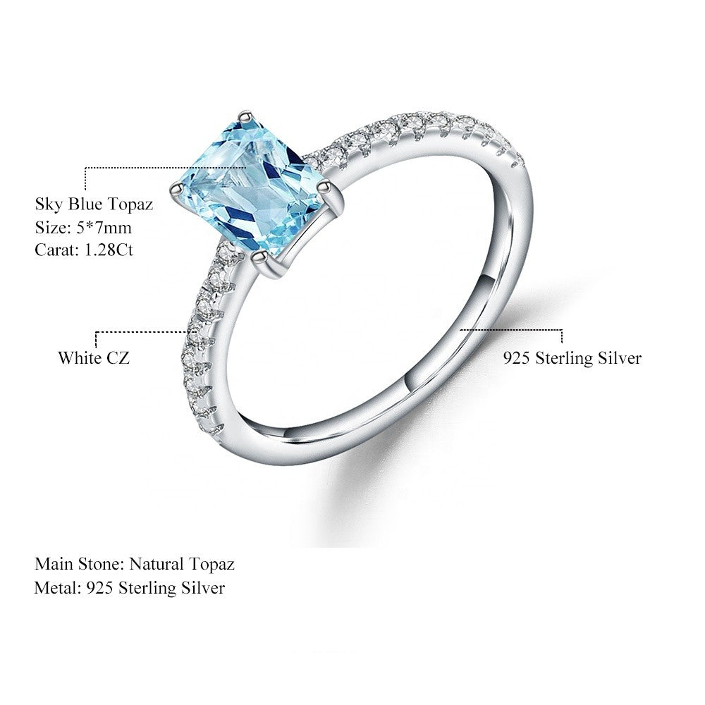 Exquisite Blue Topaz Ring - Emerald Cut