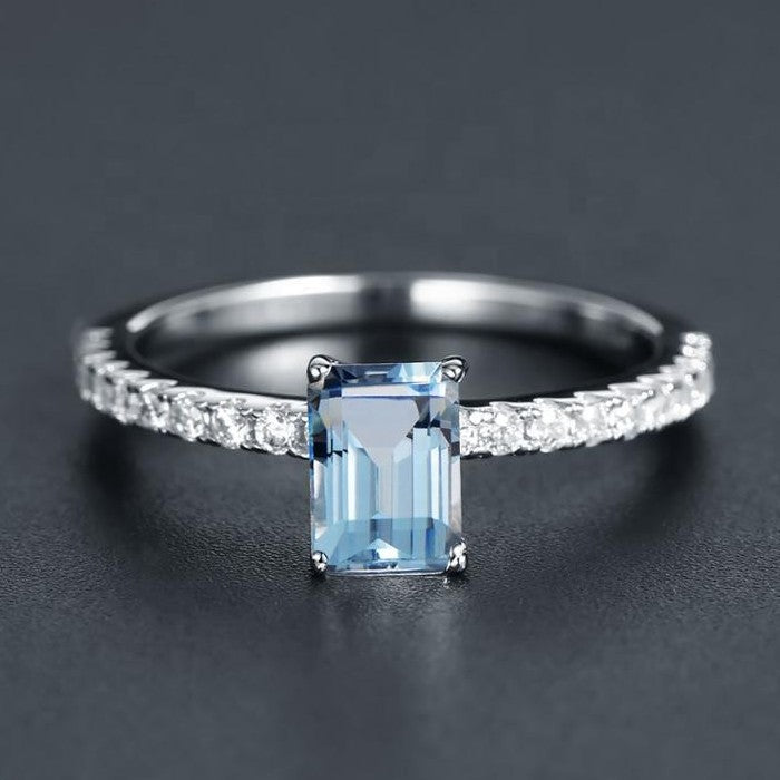 Exquisite Blue Topaz Ring - Emerald Cut
