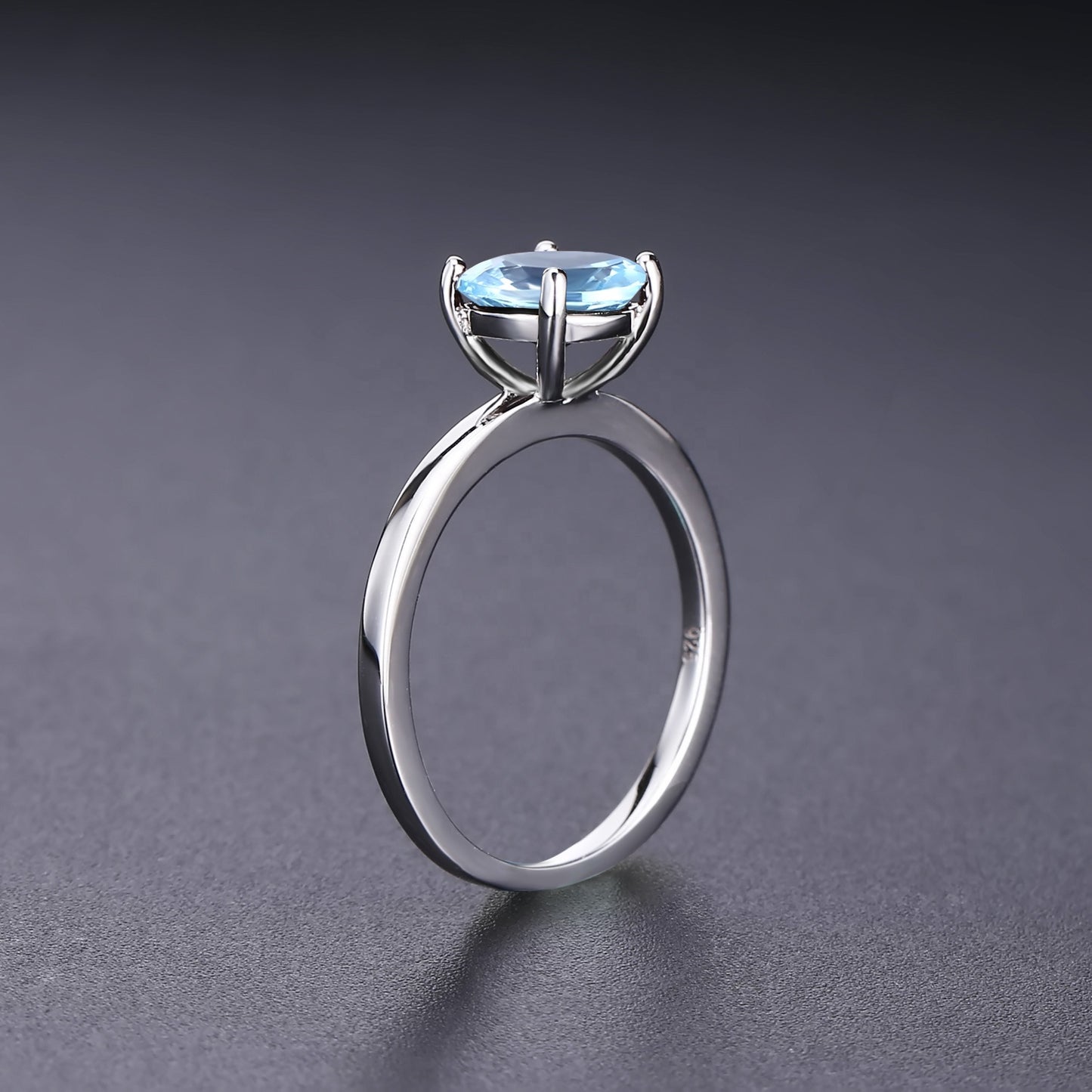 Classic 4 Claw Blue Topaz Solitaire Ring