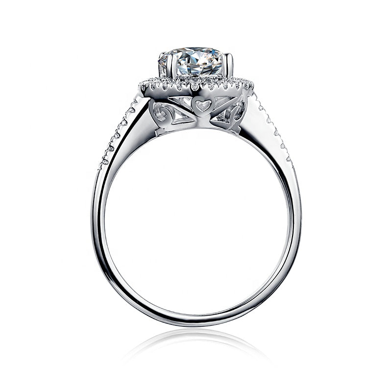 A beautiful 1.00ct moissanite engagement ring with a romantic heart-shaped halo setting.