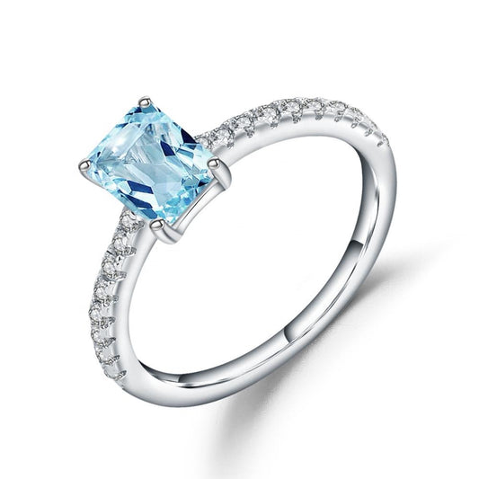 Exquisite Blue Topaz Ring - Emerald Cut
