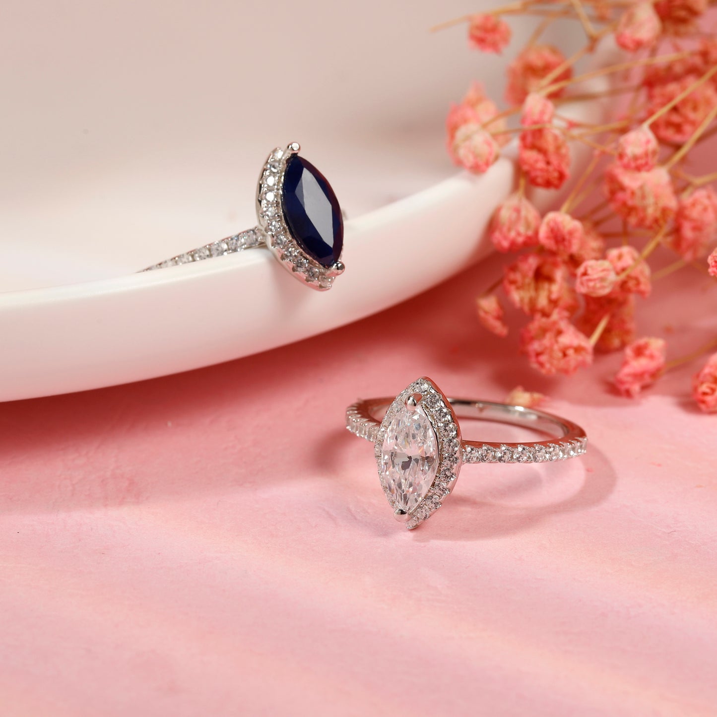 Sparkling 1.00 carat marquise cut moissanite engagement ring set in a delicate sterling silver halo setting