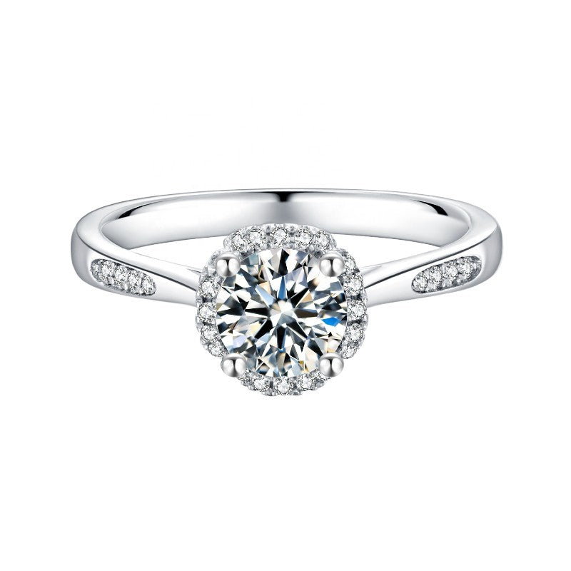 This 9ct white gold engagement ring showcases a brilliant 1.00ct moissanite encircled by a modern halo design.