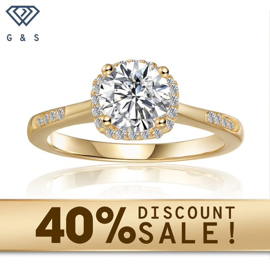 A contemporary engagement ring featuring a dazzling 1.00ct moissanite center stone, meticulously set within a delicate pave halo of smaller moissanites, all crafted in polished, warm 9ct yellow gold. The ring boasts a sleek, modern design with clean lines and a comfortable band, perfect for everyday wear.