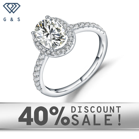 A 1.00ct oval moissanite sparkles within a delicate halo setting on a 9ct white gold band.