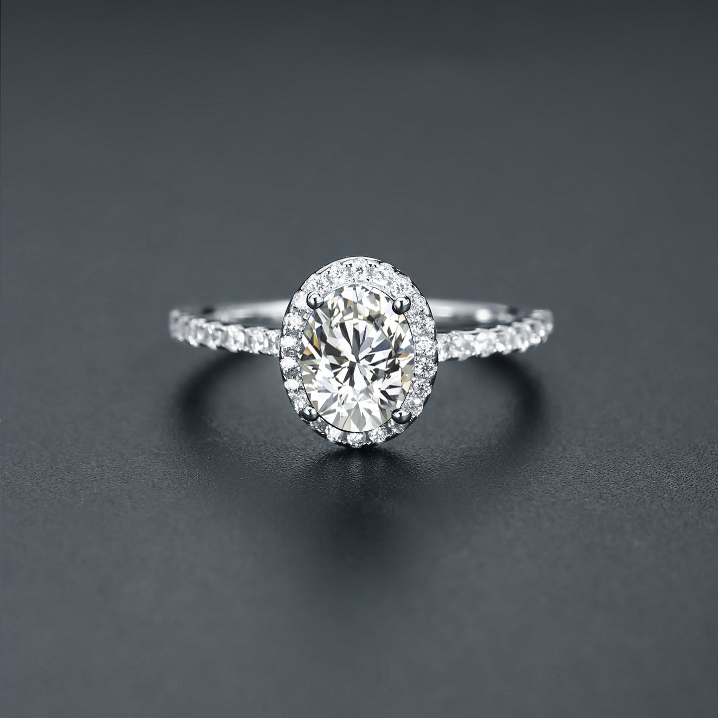 This 9ct white gold engagement ring features a brilliant oval moissanite surrounded by a dazzling halo.