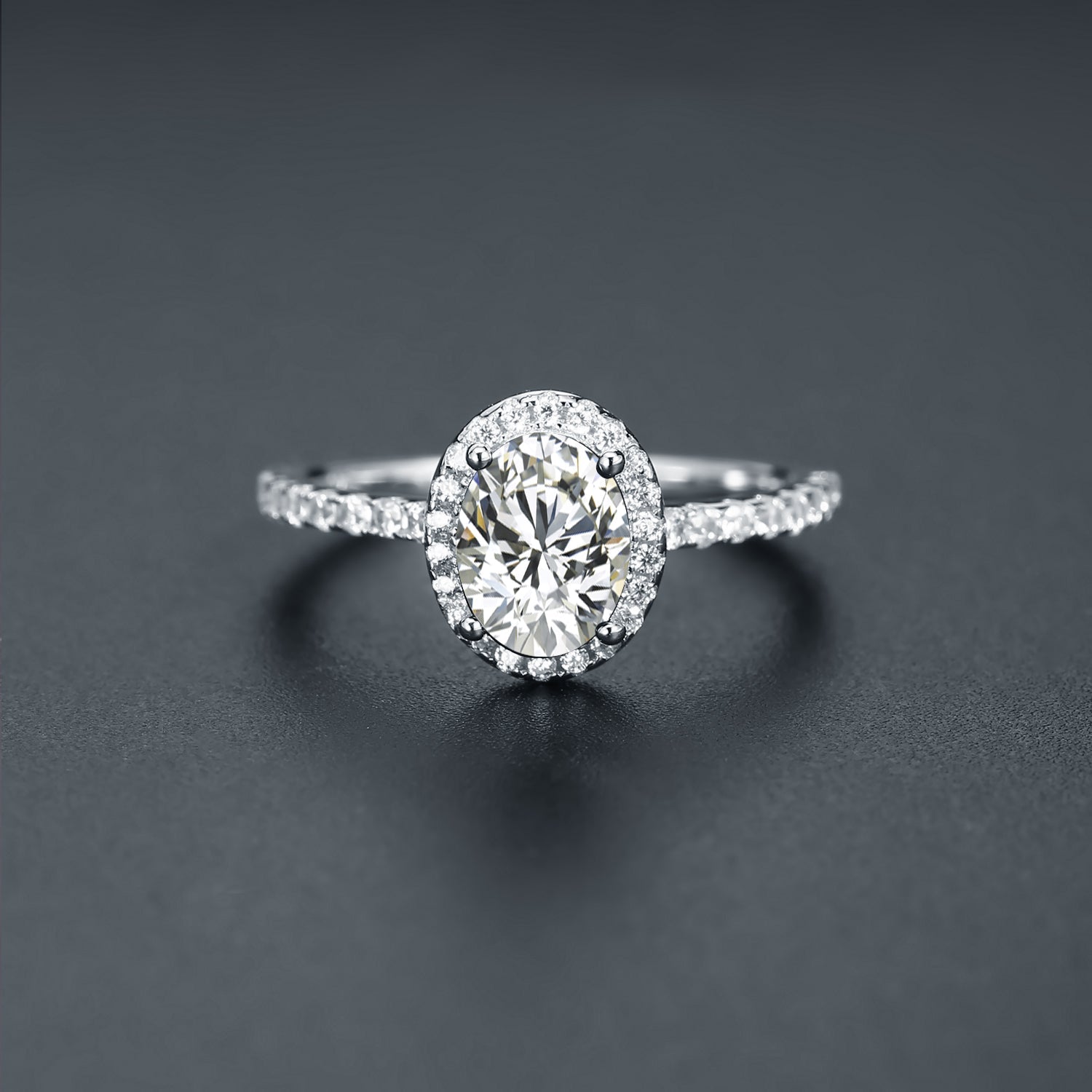 This 9ct white gold engagement ring features a brilliant oval moissanite surrounded by a dazzling halo.