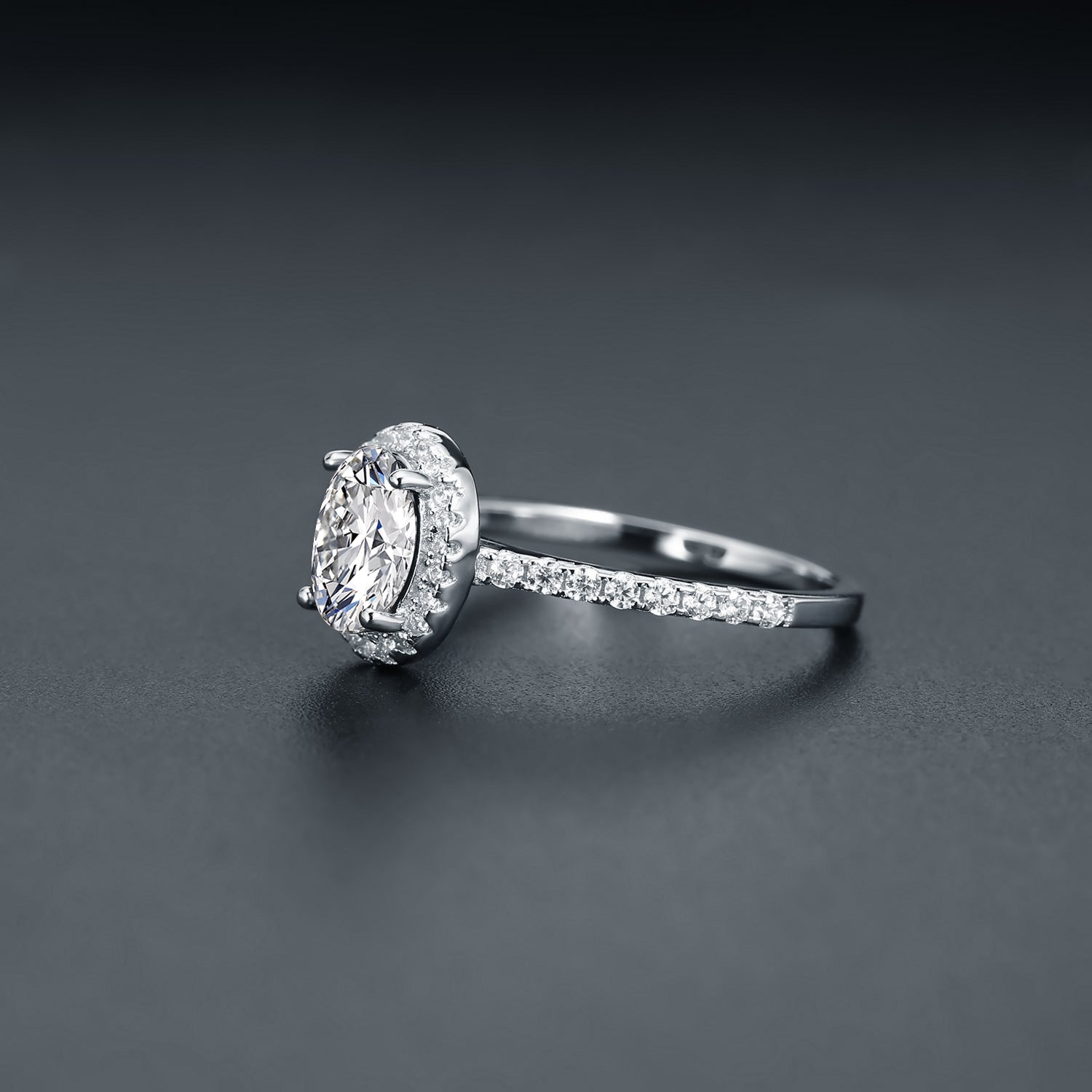 A classic and sophisticated design showcasing a 1.00ct oval moissanite with a sparkling halo.