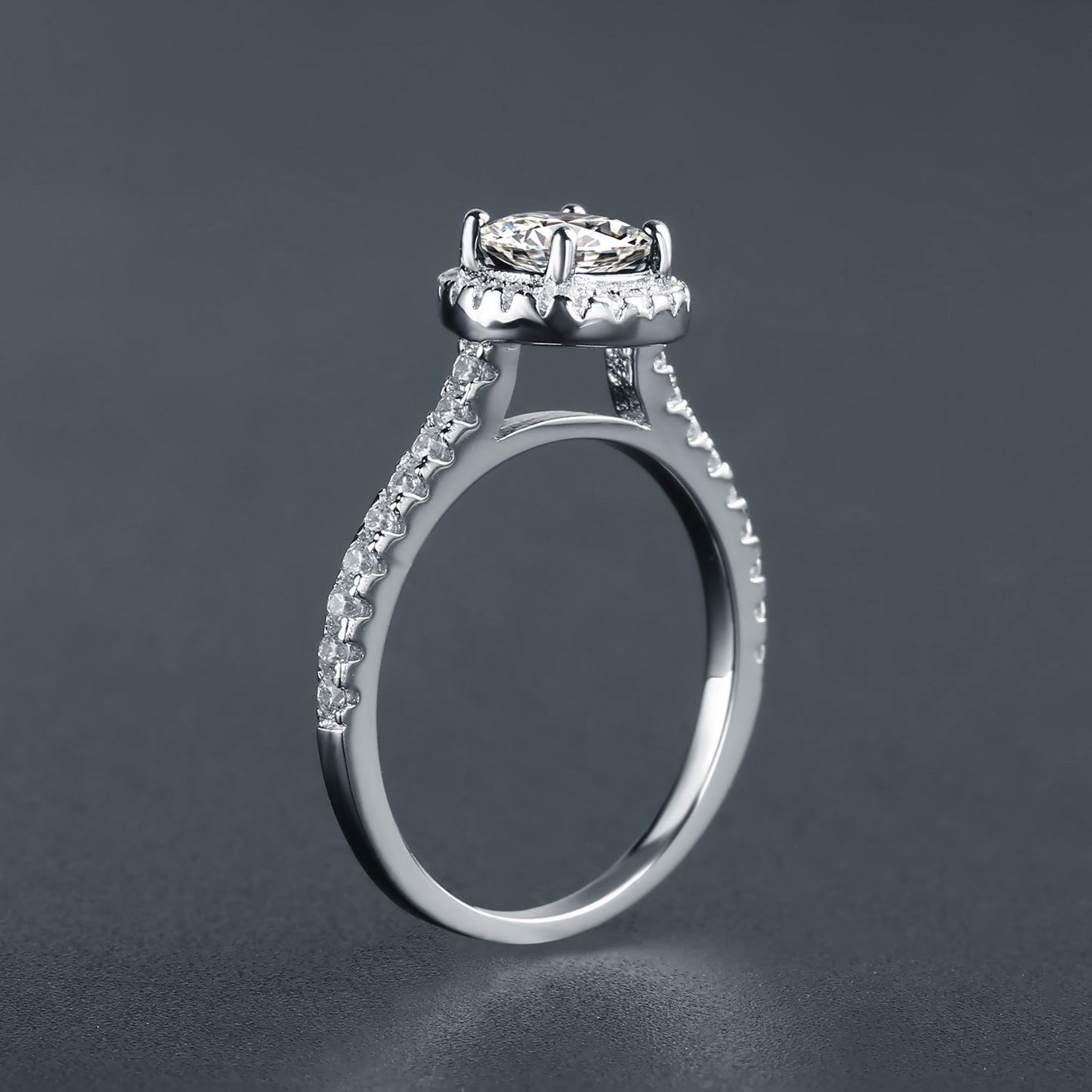 A stunning sterling silver engagement ring featuring a 1.00ct oval moissanite and halo design, offering brilliance and style.