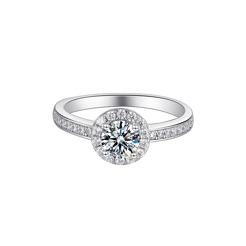 This 9ct white gold engagement ring features a brilliant 0.50ct moissanite surrounded by a dazzling pave halo.