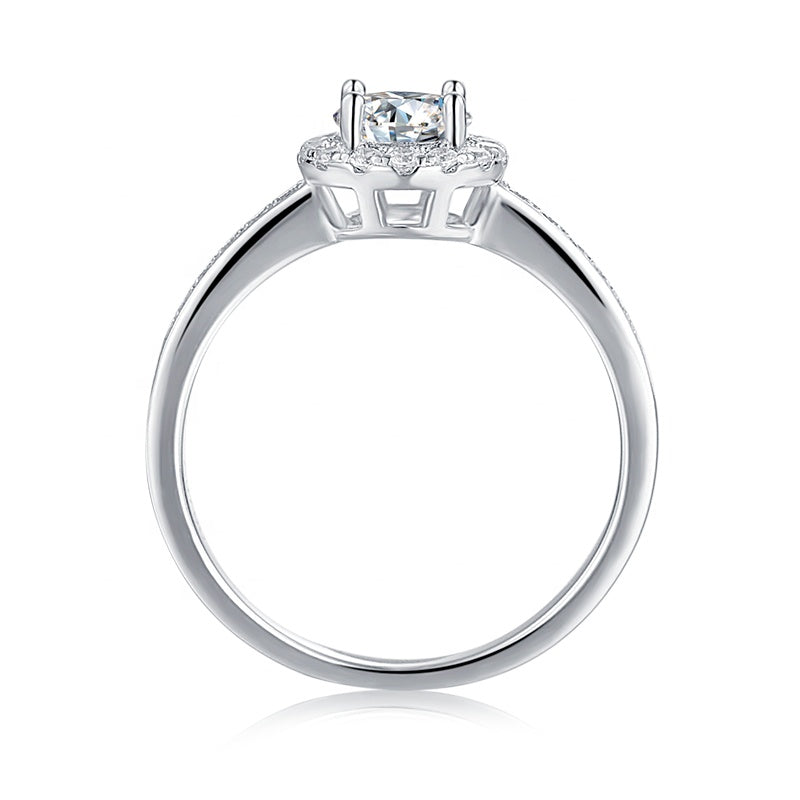 A classic and sophisticated design showcasing a 0.50ct moissanite with a sparkling pave halo.
