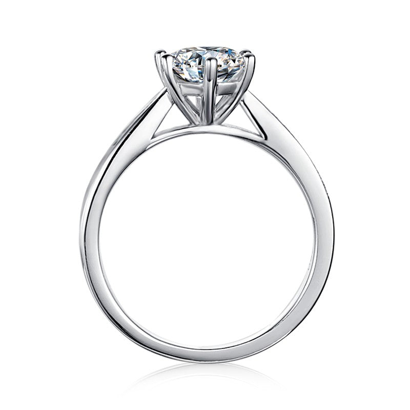 A classic and sophisticated design showcasing a 1.00ct moissanite with a tapered pave setting.