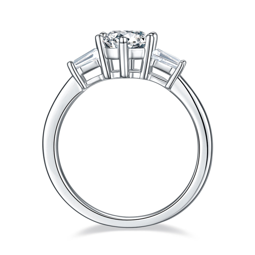 A beautiful sterling silver engagement ring featuring three dazzling moissanites, representing a lifetime of love and commitment.