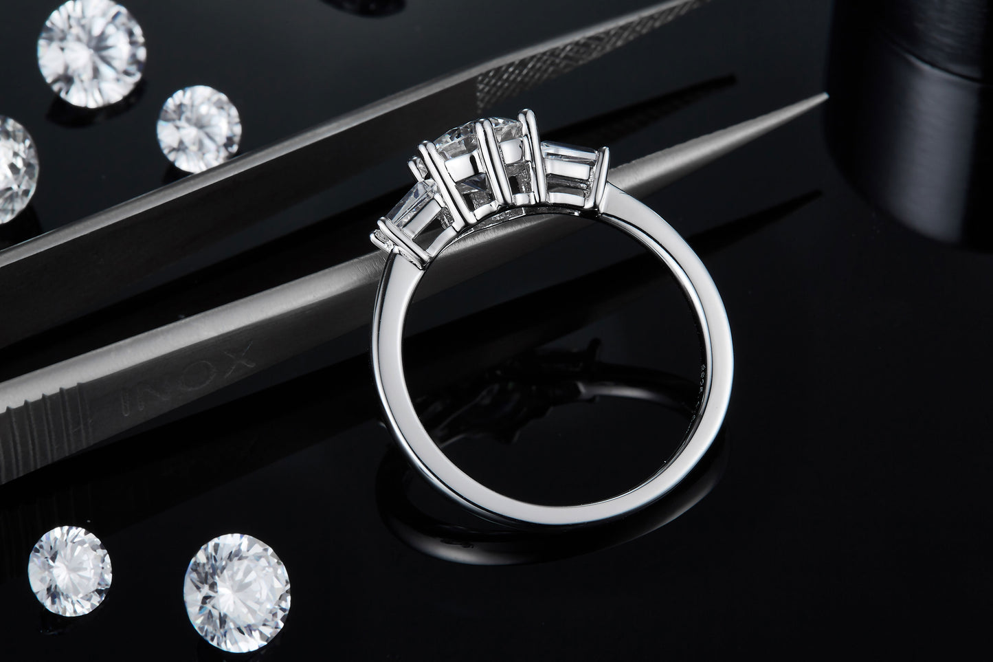 A timeless design with three sparkling moissanites totaling 1.00ct, set in a sleek and polished sterling silver band.