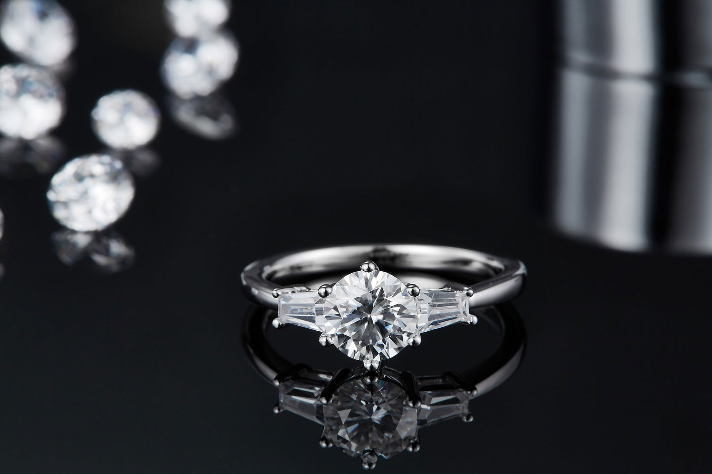 This sterling silver engagement ring features a stunning trilogy design, with three brilliant moissanites signifying everlasting love. Total Carat weight of 1.00ct.