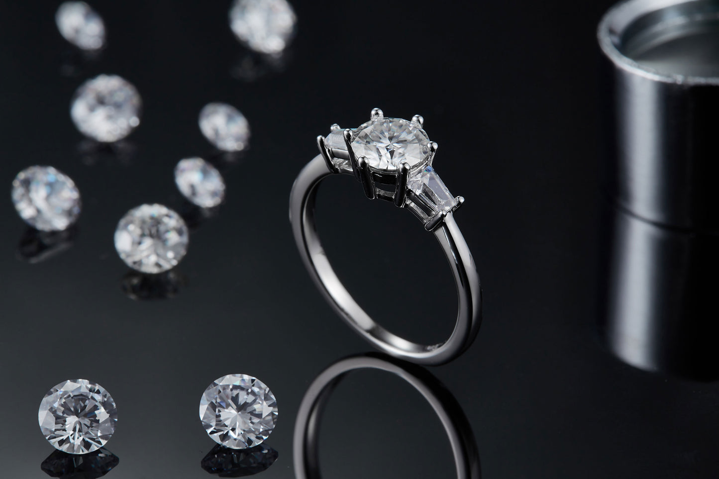A very elegant and sparkling Sterling Silver setting showcasing three beautiful Moissanite stones.