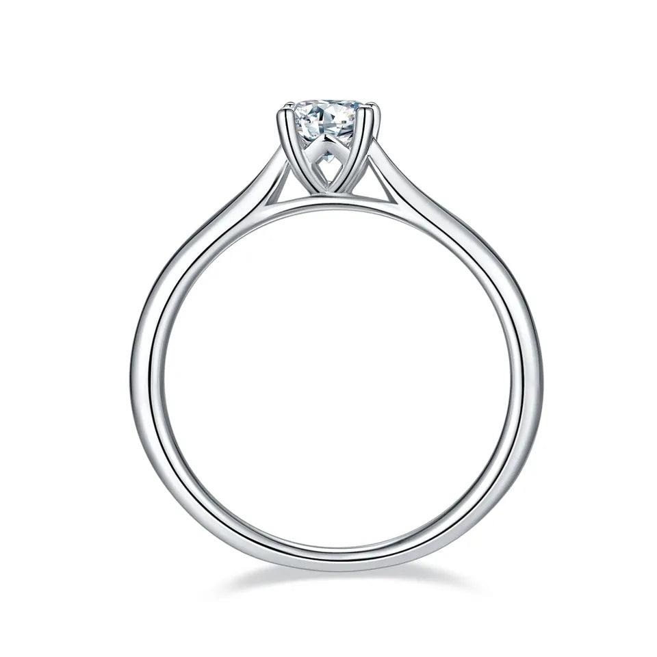 Simple and sophisticated 4-prong solitaire engagement ring with a 0.50-carat moissanite gemstone.
