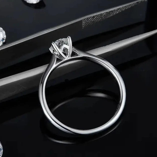 Solitaire engagement ring with a dazzling 0.50-carat moissanite in a 4-prong setting.