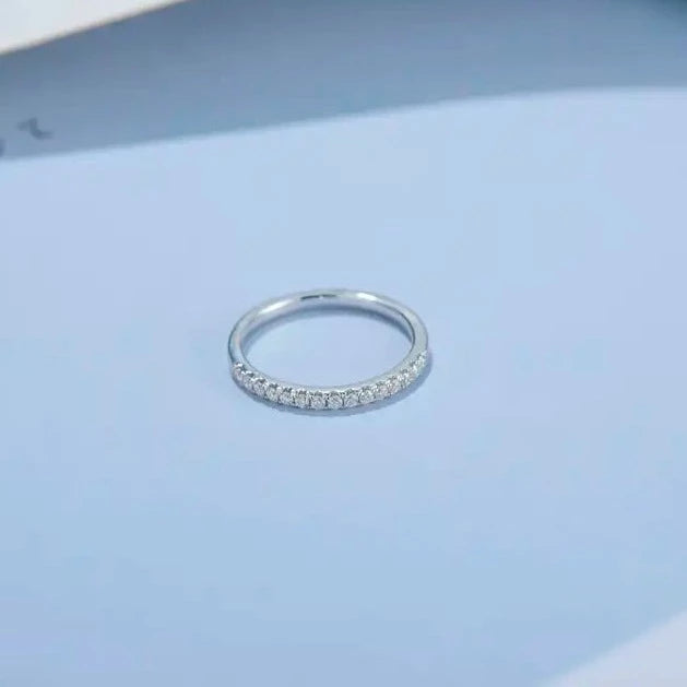 Matching wedding bands in 9ct white gold with sparkling moissanites, ideal for couples seeking a timeless symbol of their commitment.