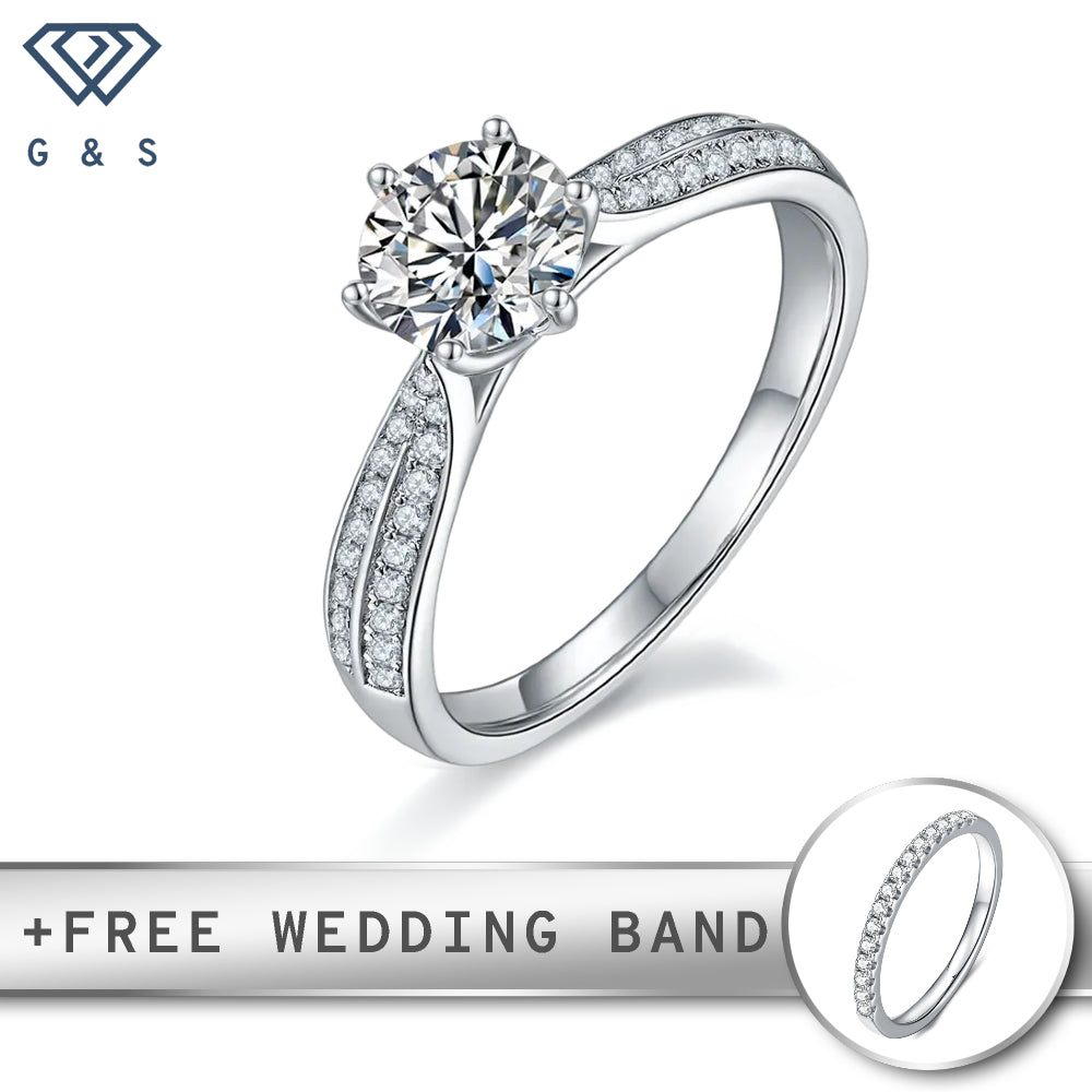 A timeless engagement ring featuring a 1.00ct moissanite center stone, surrounded by a delicate pave setting of smaller moissanites, all crafted in polished sterling silver.