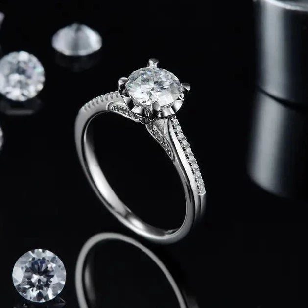 This ring features a brilliant 1.00ct moissanite set in a refined and understated sterling silver band.