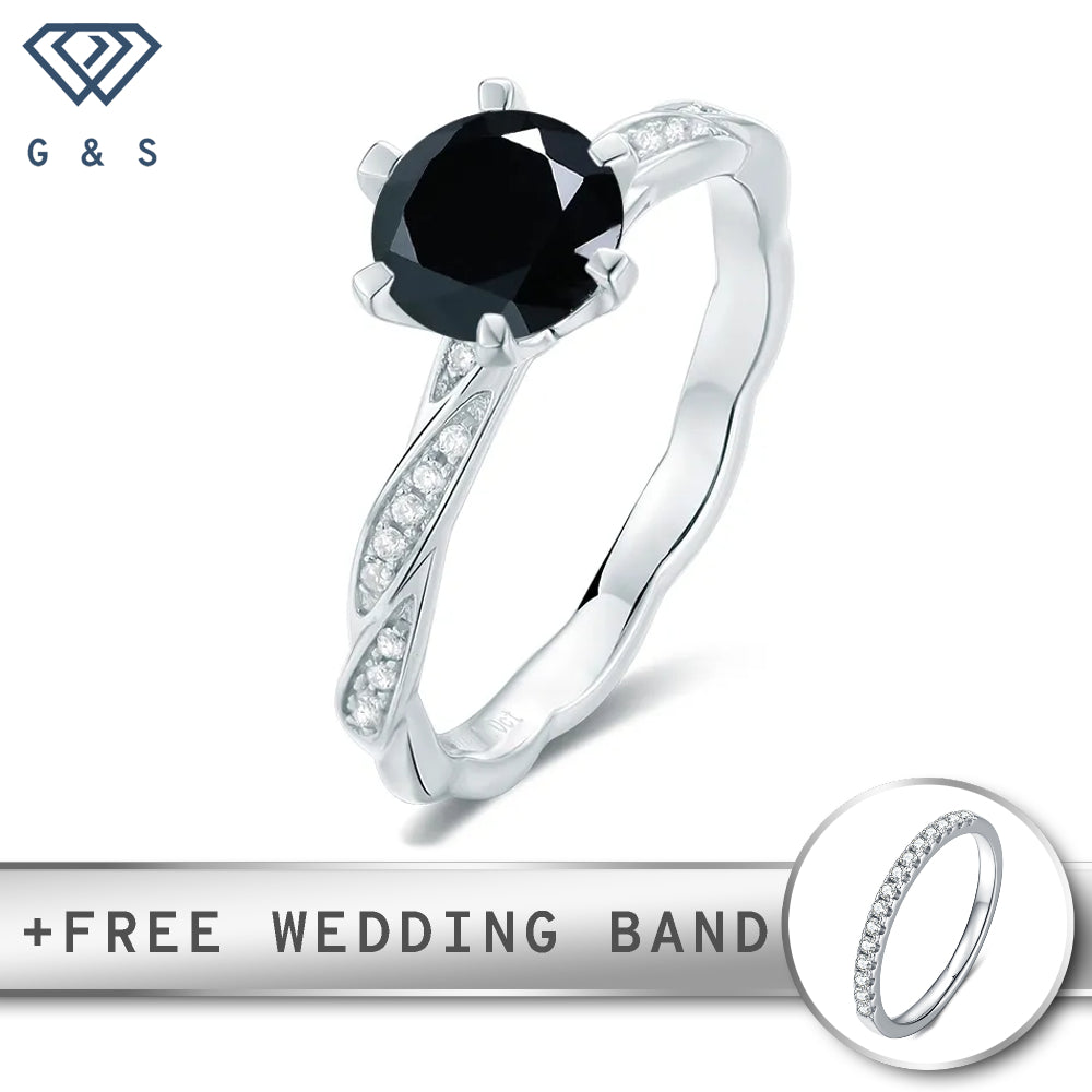 A vintage-inspired sterling silver engagement ring featuring a striking 1.00ct black moissanite center stone, with intricate details and a delicate design.
