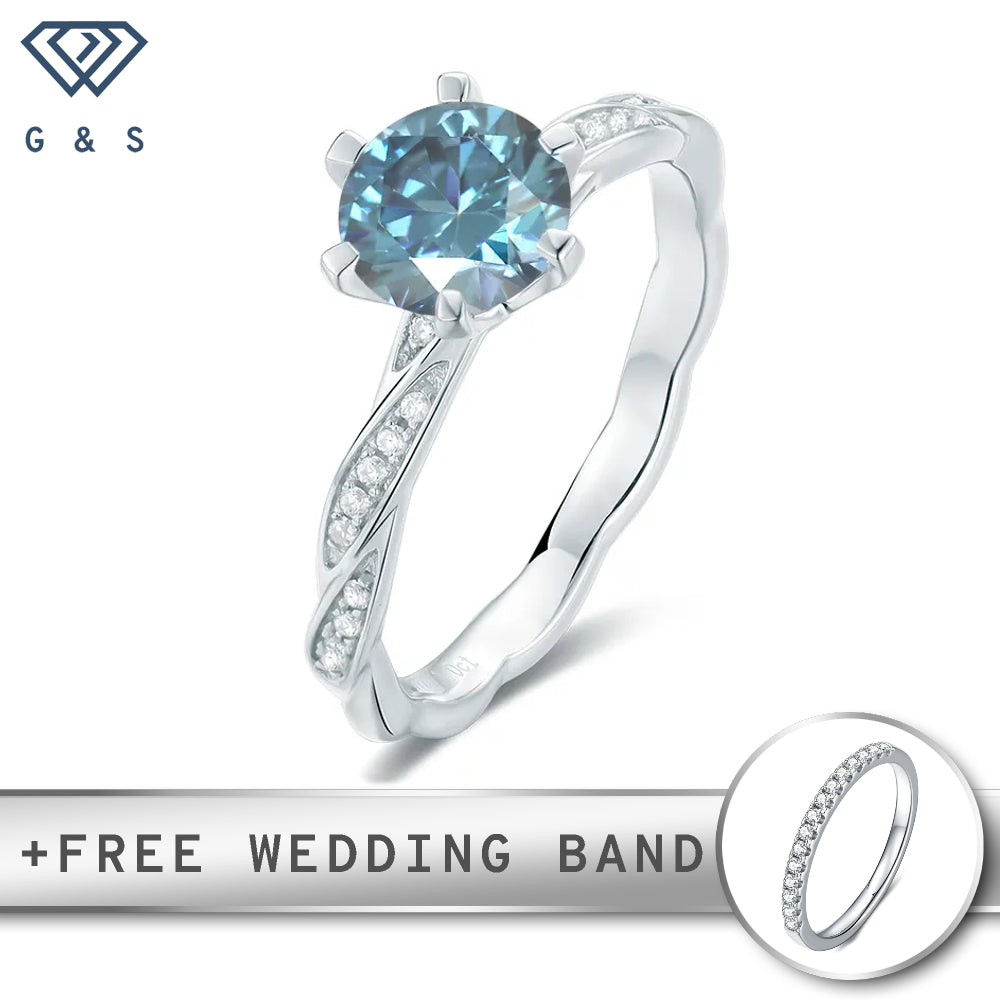 A delicate sterling silver ring featuring a 1.00ct blue moissanite in a vintage-inspired setting.