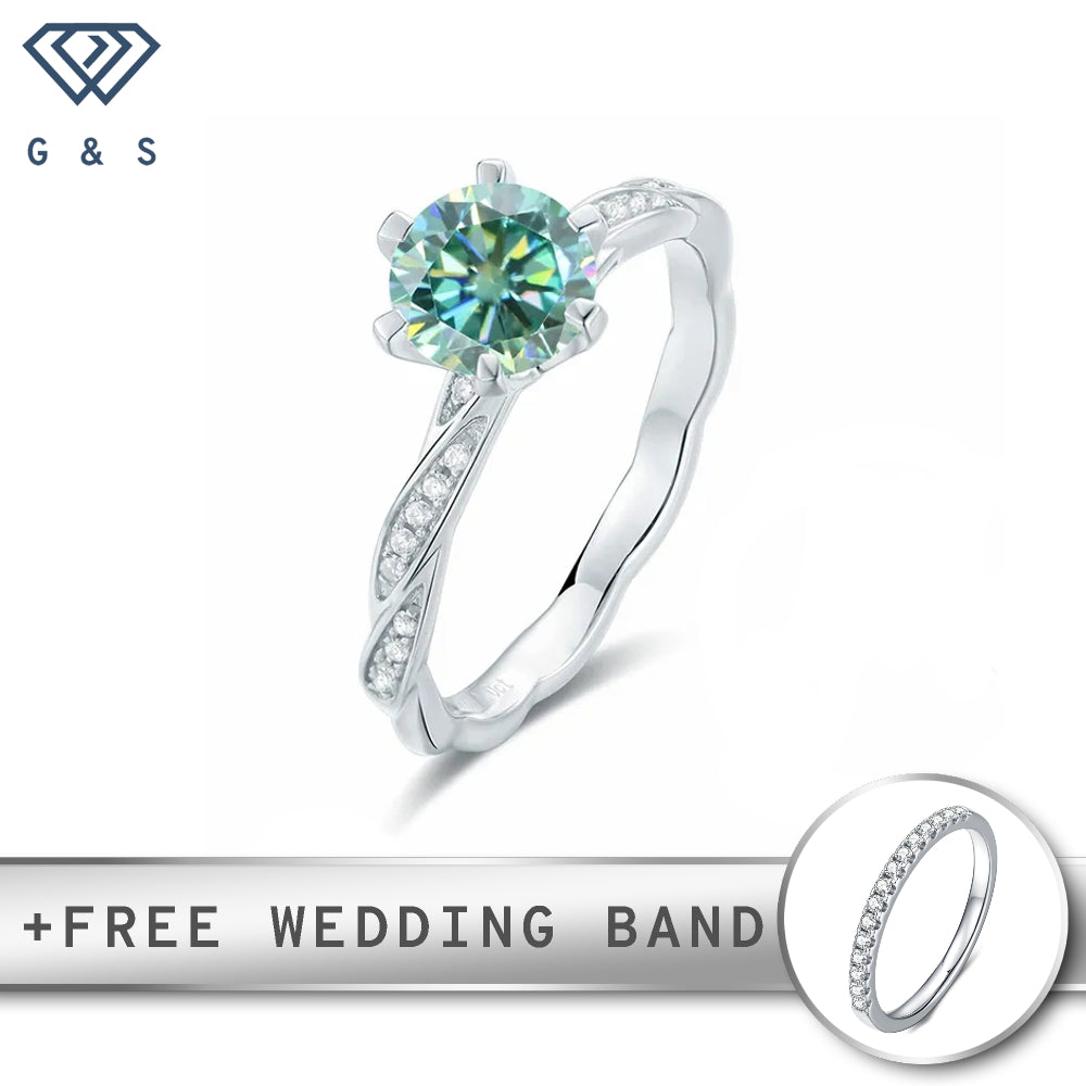 A delicate sterling silver setting showcases a 1.00ct vintage-inspired green moissanite, creating a unique and romantic engagement ring.