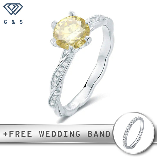 A delicate sterling silver engagement ring with a warm, vintage yellow hue, featuring a sparkling 1.00ct moissanite center stone.