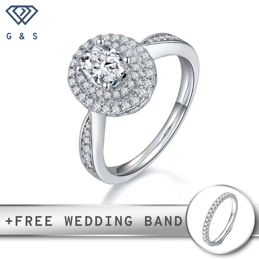 A stunning engagement ring featuring a 1.00ct oval cut moissanite surrounded by two concentric halos of sparkling stones.