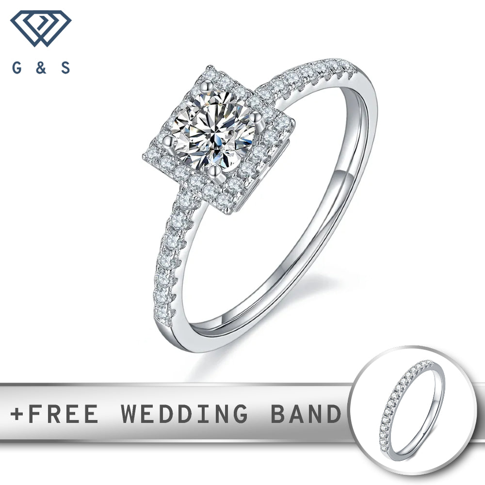A classic sterling silver engagement ring featuring a 0.50ct moissanite center stone surrounded by a delicate halo of smaller moissanites.