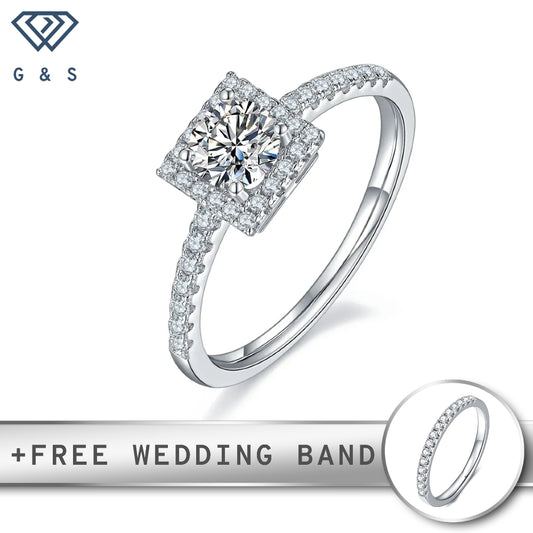 A classic sterling silver engagement ring featuring a 0.50ct moissanite center stone surrounded by a delicate halo of smaller moissanites.
