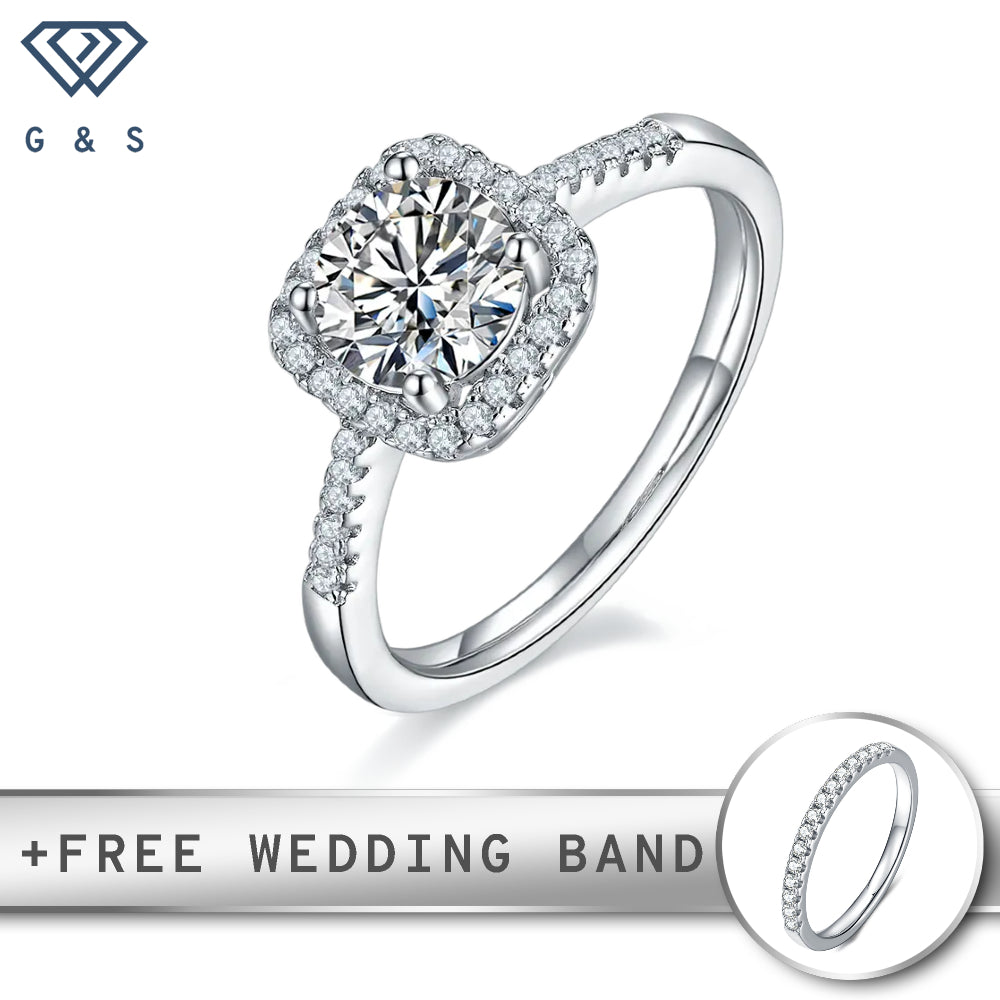 A classic engagement ring featuring a sparkling 1.00ct moissanite center stone surrounded by a delicate halo, set in polished sterling silver.