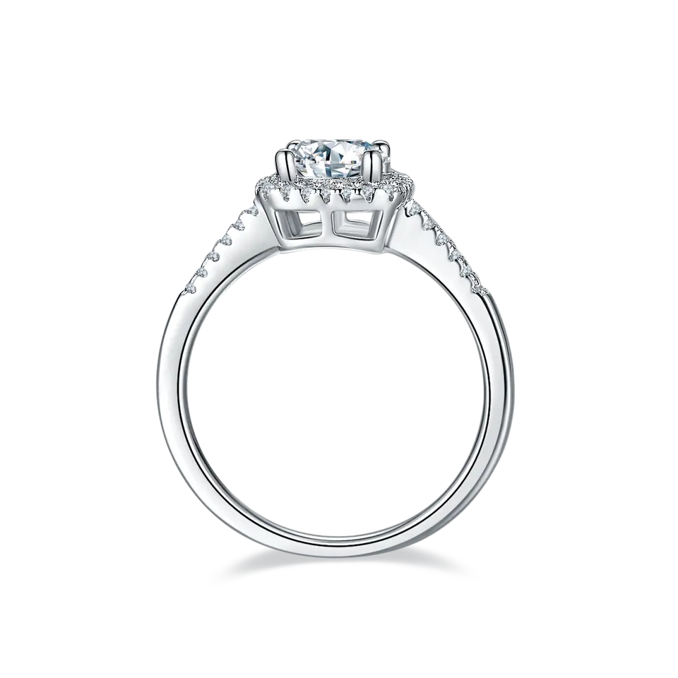 A timeless halo design highlights the brilliance of a 1.00ct moissanite center stone in this elegant sterling silver engagement ring.