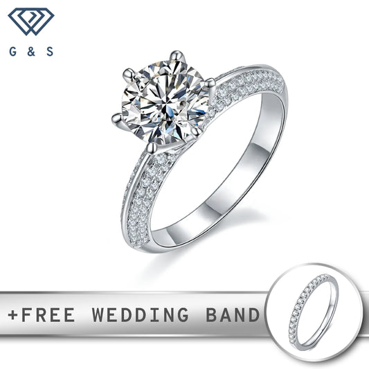 A dazzling 2.00ct moissanite center stone surrounded by a delicate pave setting on the band, creating a sparkling and sophisticated look.