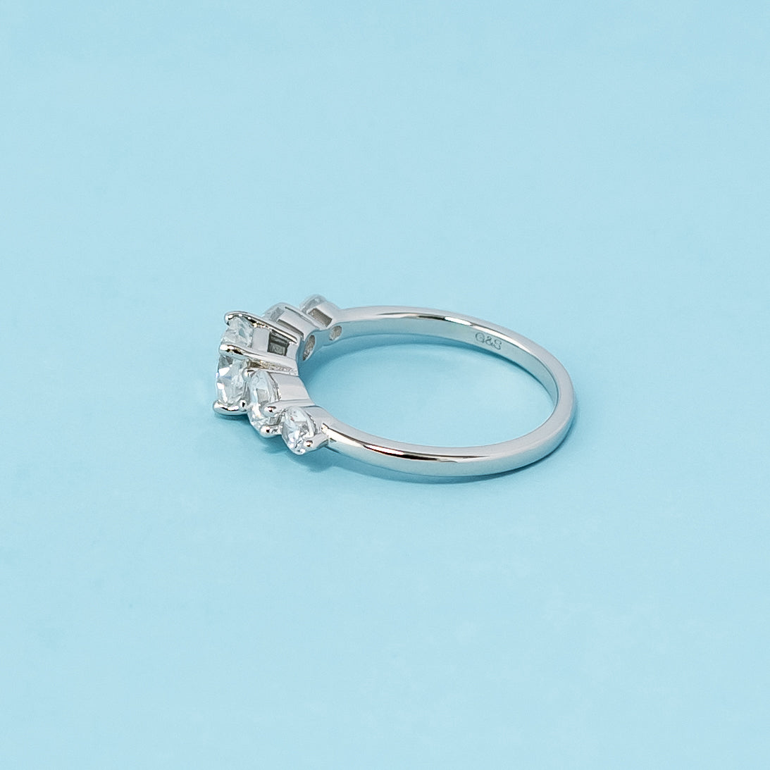 Stunning five-stone engagement ring showcasing the brilliance and fire of cushion cut moissanites, crafted in 9ct white gold.